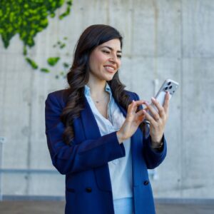 Businesswoman using smartphone showing global connectivity and communication