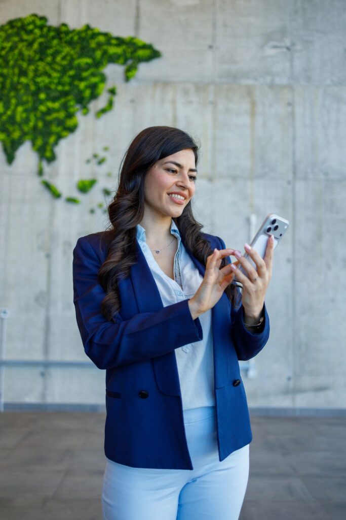 Businesswoman using smartphone showing global connectivity and communication